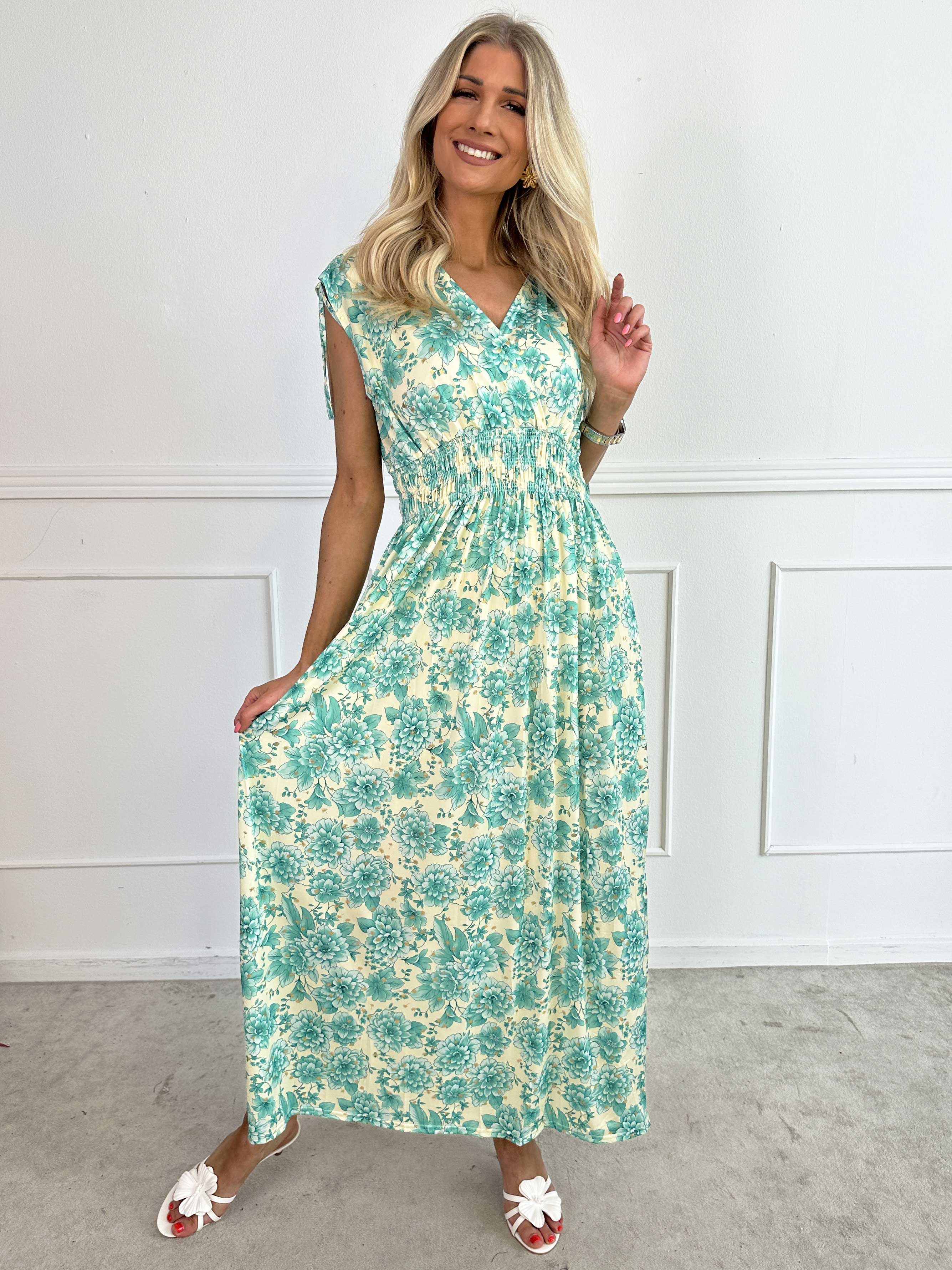 Pams Blossom Sleeveless - Lång elastisk klänning i blommigt mönster