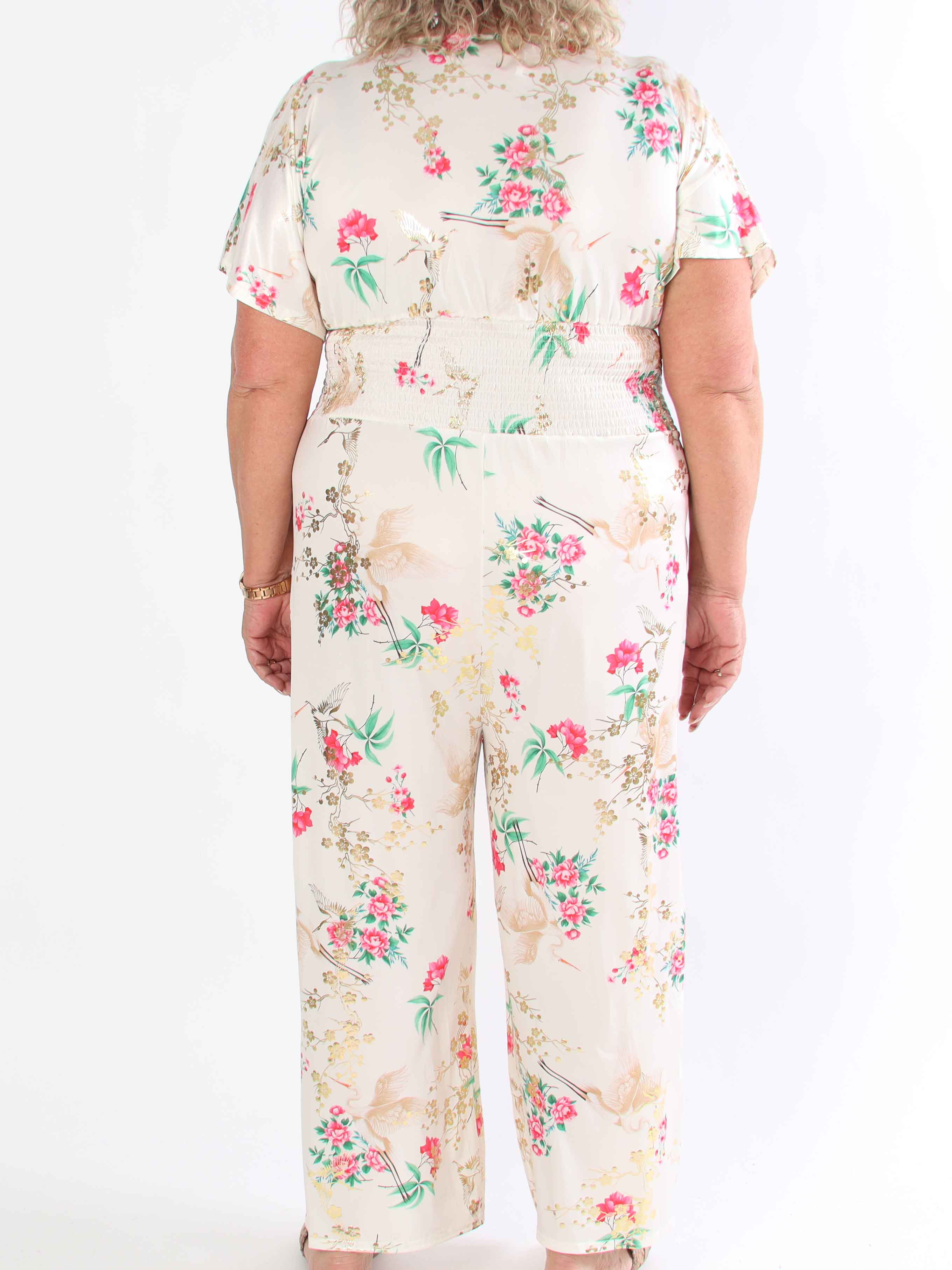 Pams Fly Jumpsuit - Elastisk plus size byxdress med blommor- och fåglemönster