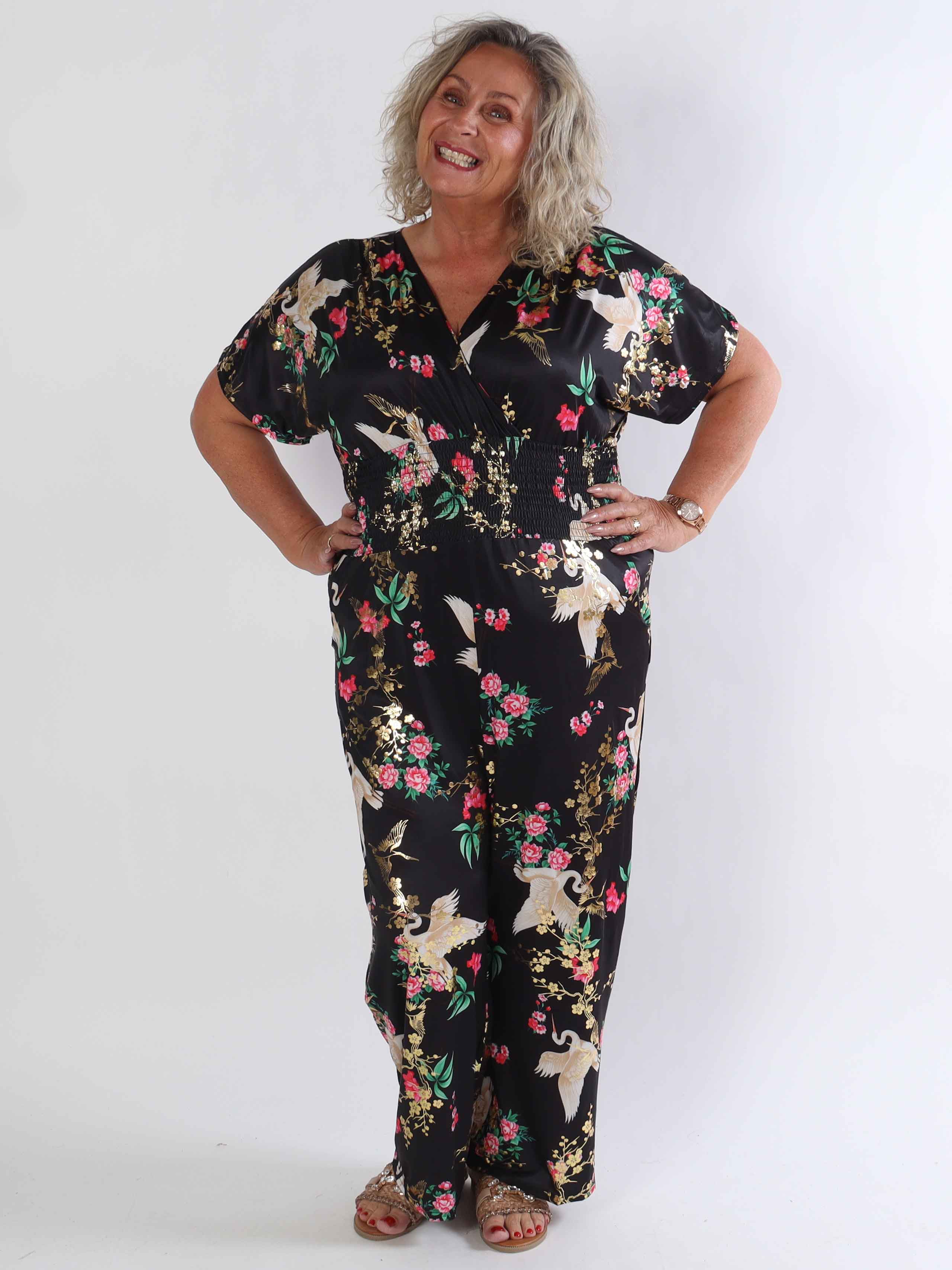 Pams Fly Jumpsuit - Elastisk plus size byxdress med blommor- och fåglemönster