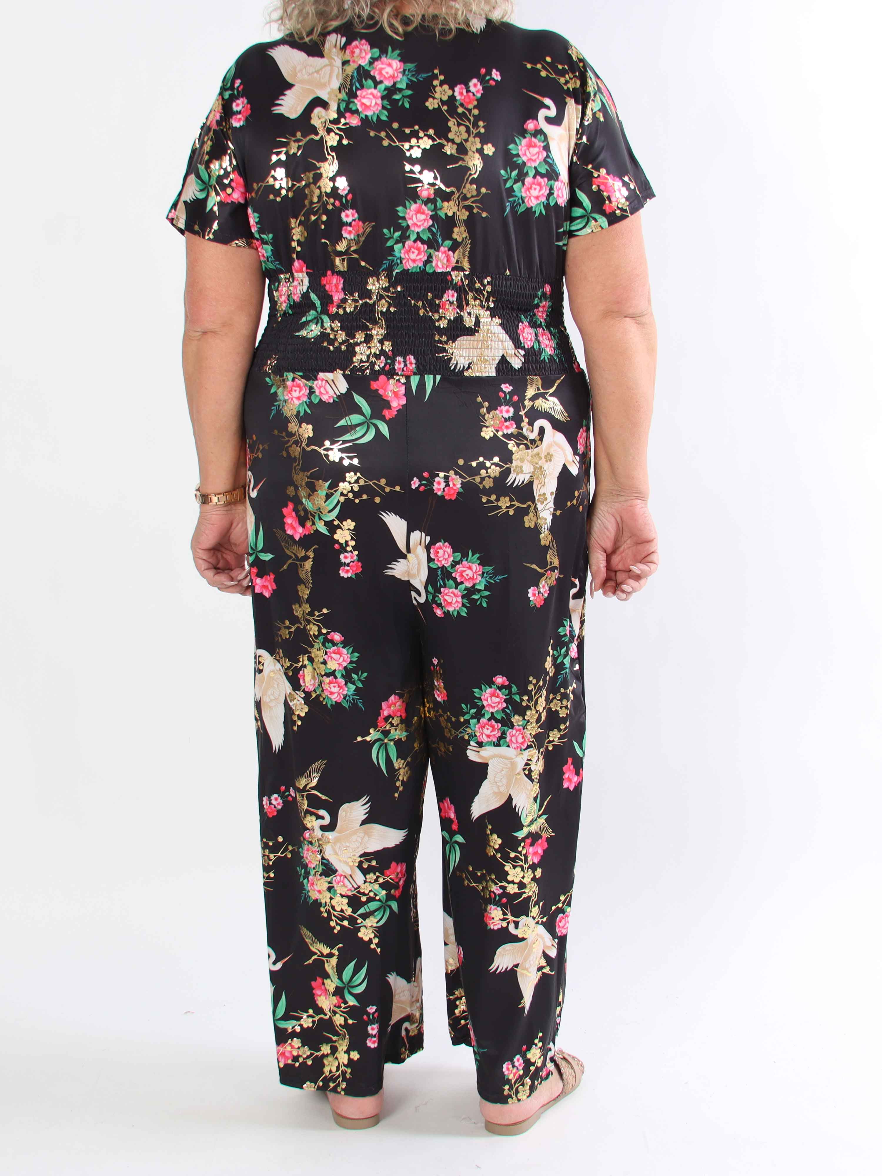Pams Fly Jumpsuit - Elastisk plus size byxdress med blommor- och fåglemönster