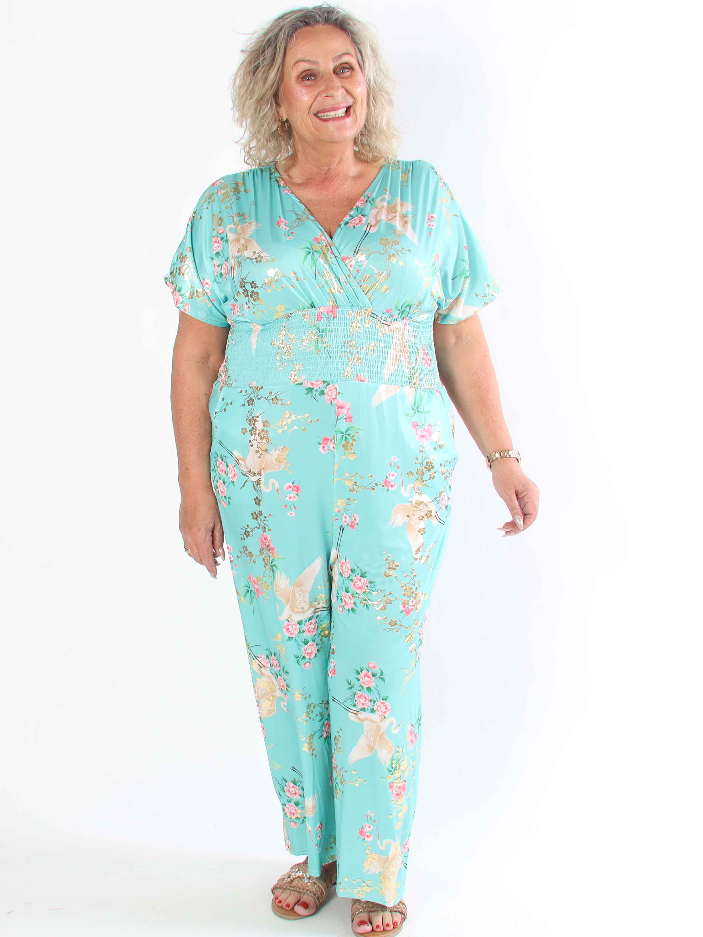 Pams Fly Jumpsuit - Elastisk plus size byxdress med blommor- och fåglemönster