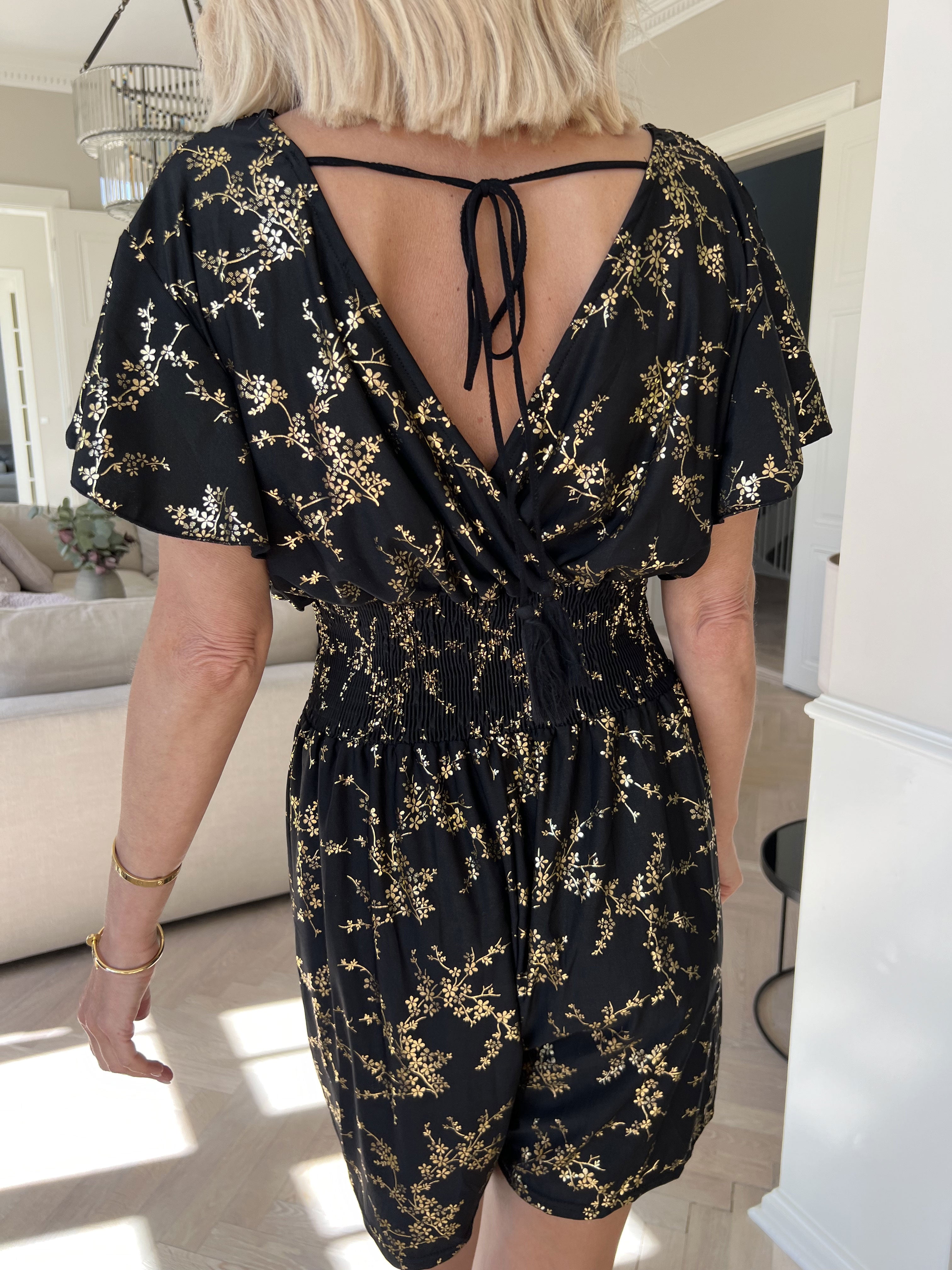 Pams Gold Playsuit - Jumpsuit med resår och guldtryck