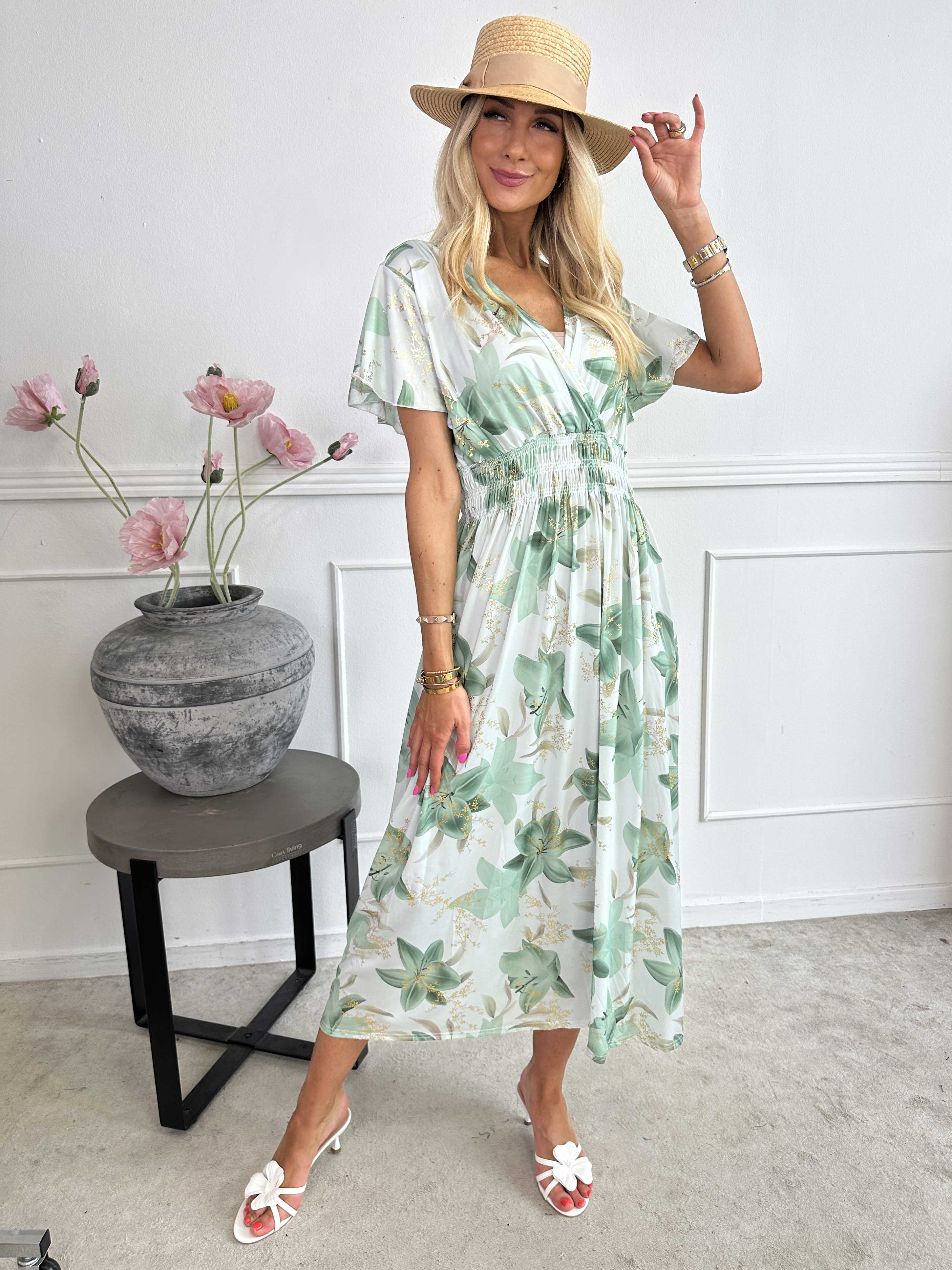 Pams Lilies - Elastisk klänning med liljemönster och gulddetaljer