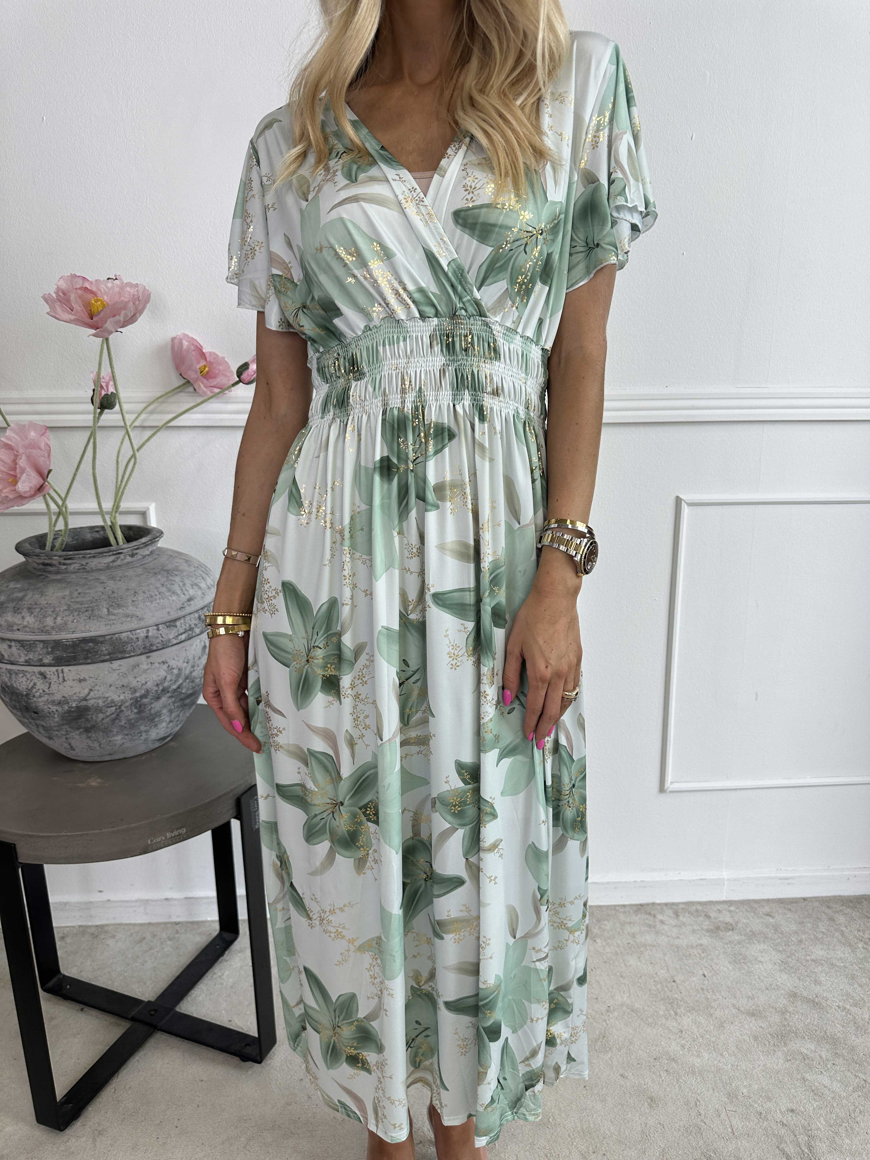 Pams Lilies - Elastisk klänning med liljemönster och gulddetaljer