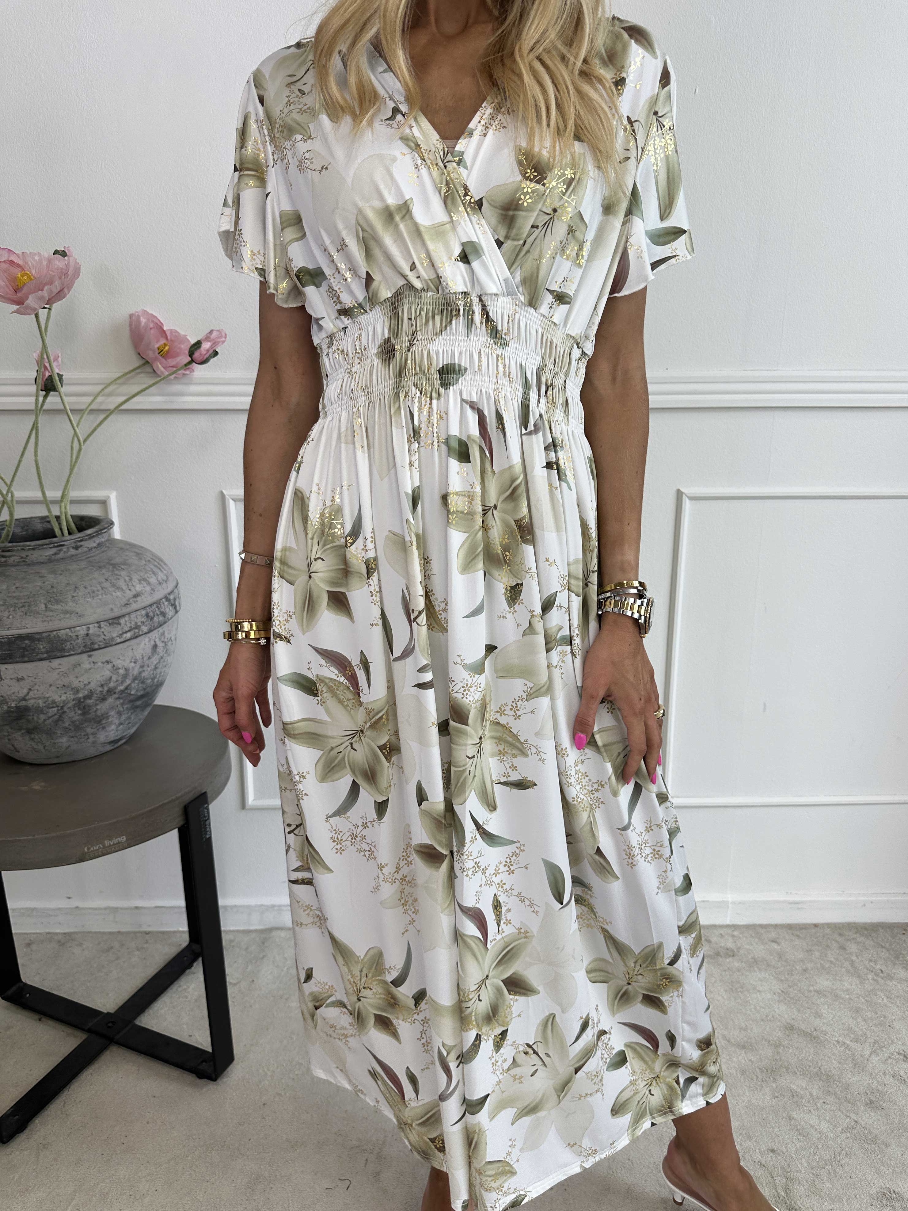 Pams Lilies - Elastisk klänning med liljemönster och gulddetaljer