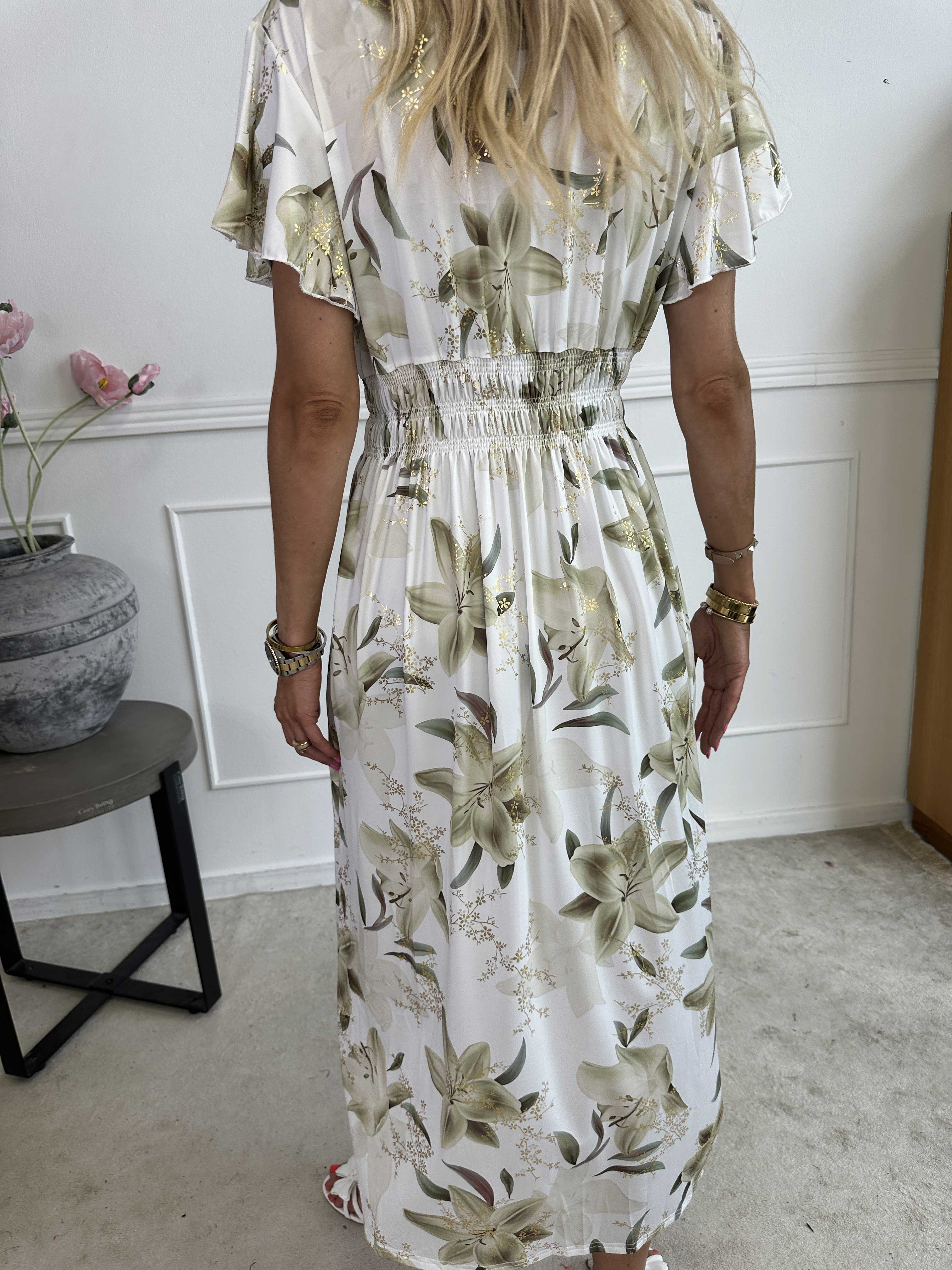 Pams Lilies - Elastisk klänning med liljemönster och gulddetaljer