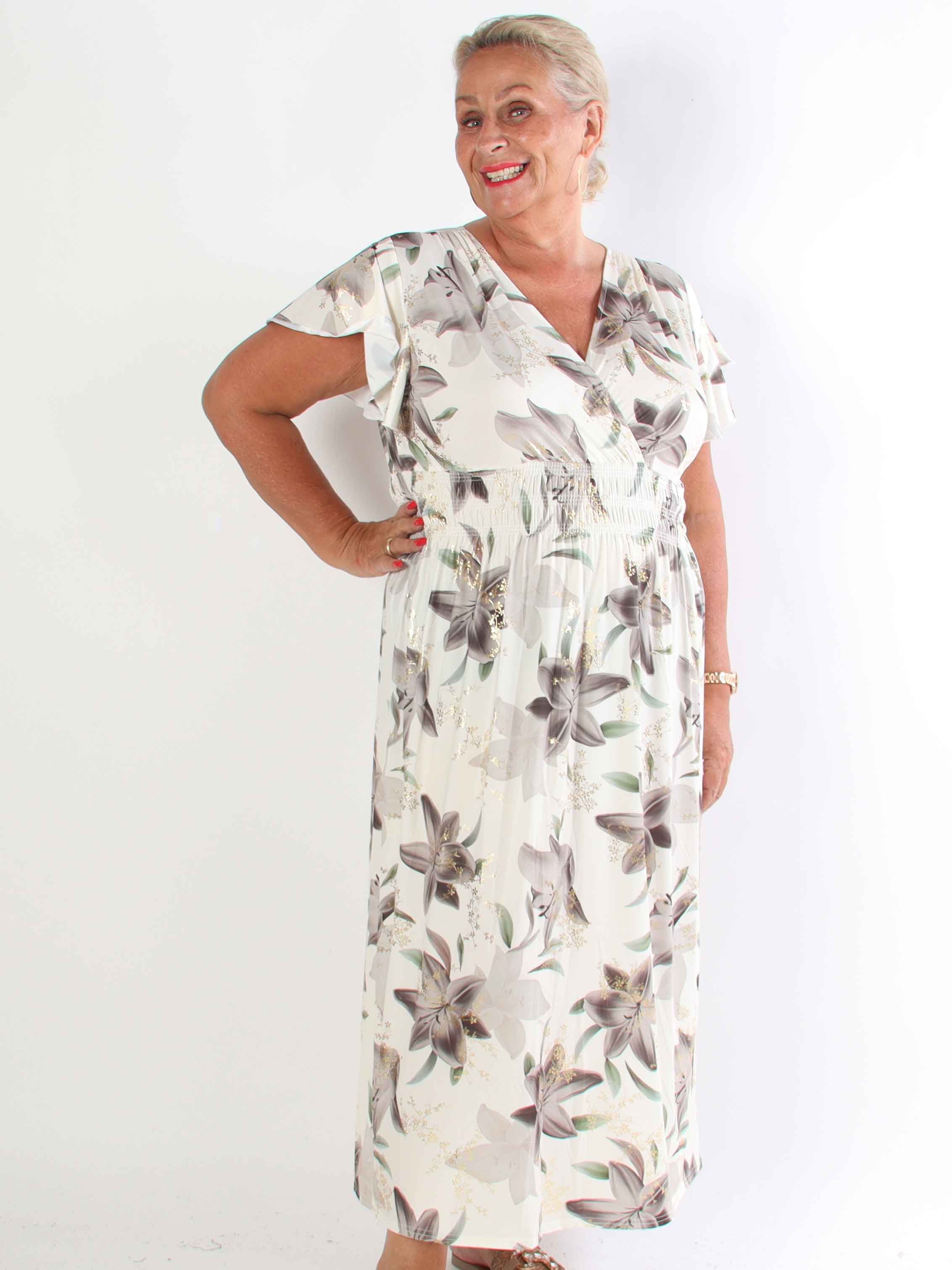 Pams Lilies - Elastisk plus size klänning med liljemönster och gulddetaljer