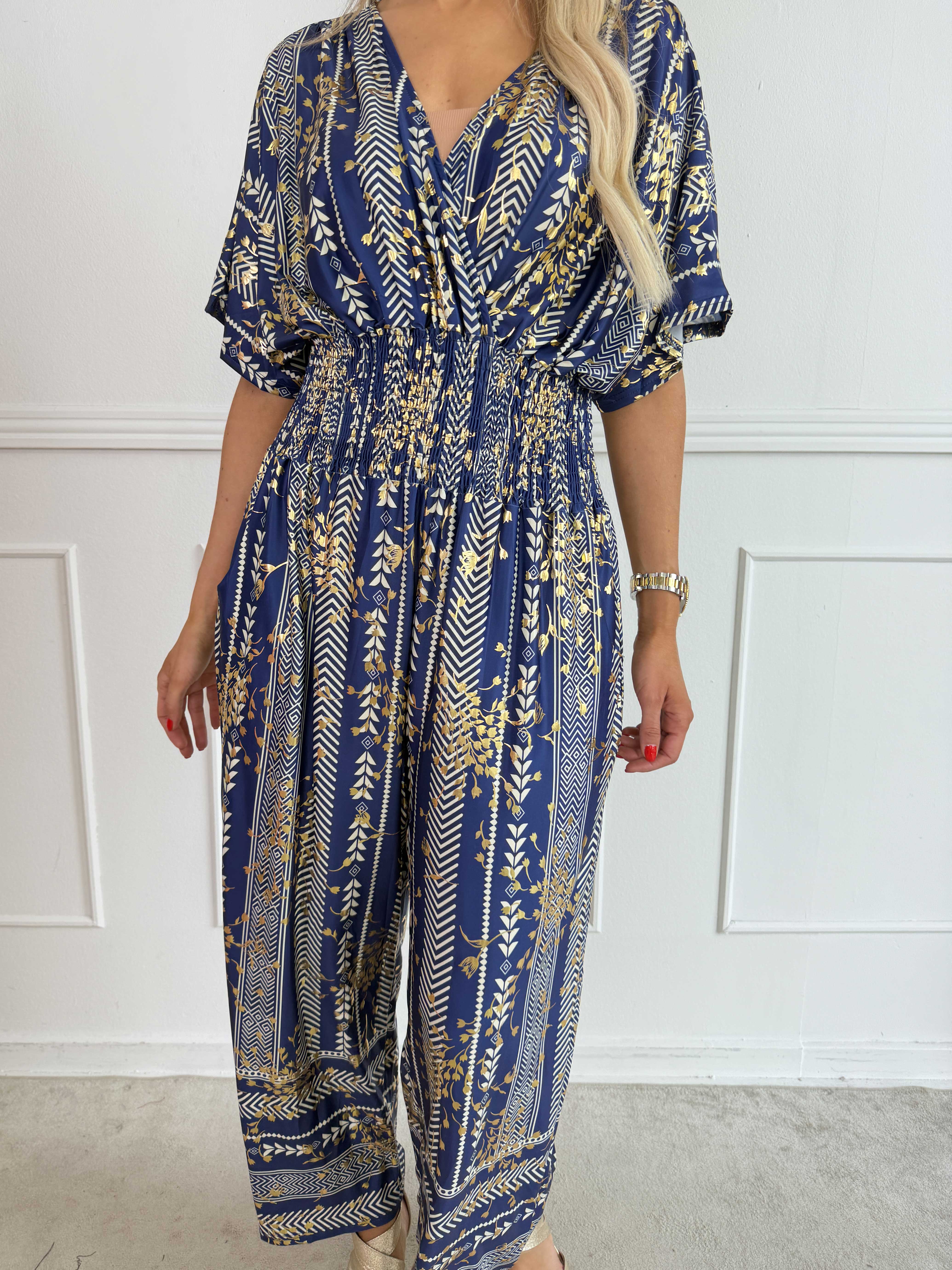 Pams Tribal Jumpsuit - Elastisk mønstret buksedragt med små guld blomster
