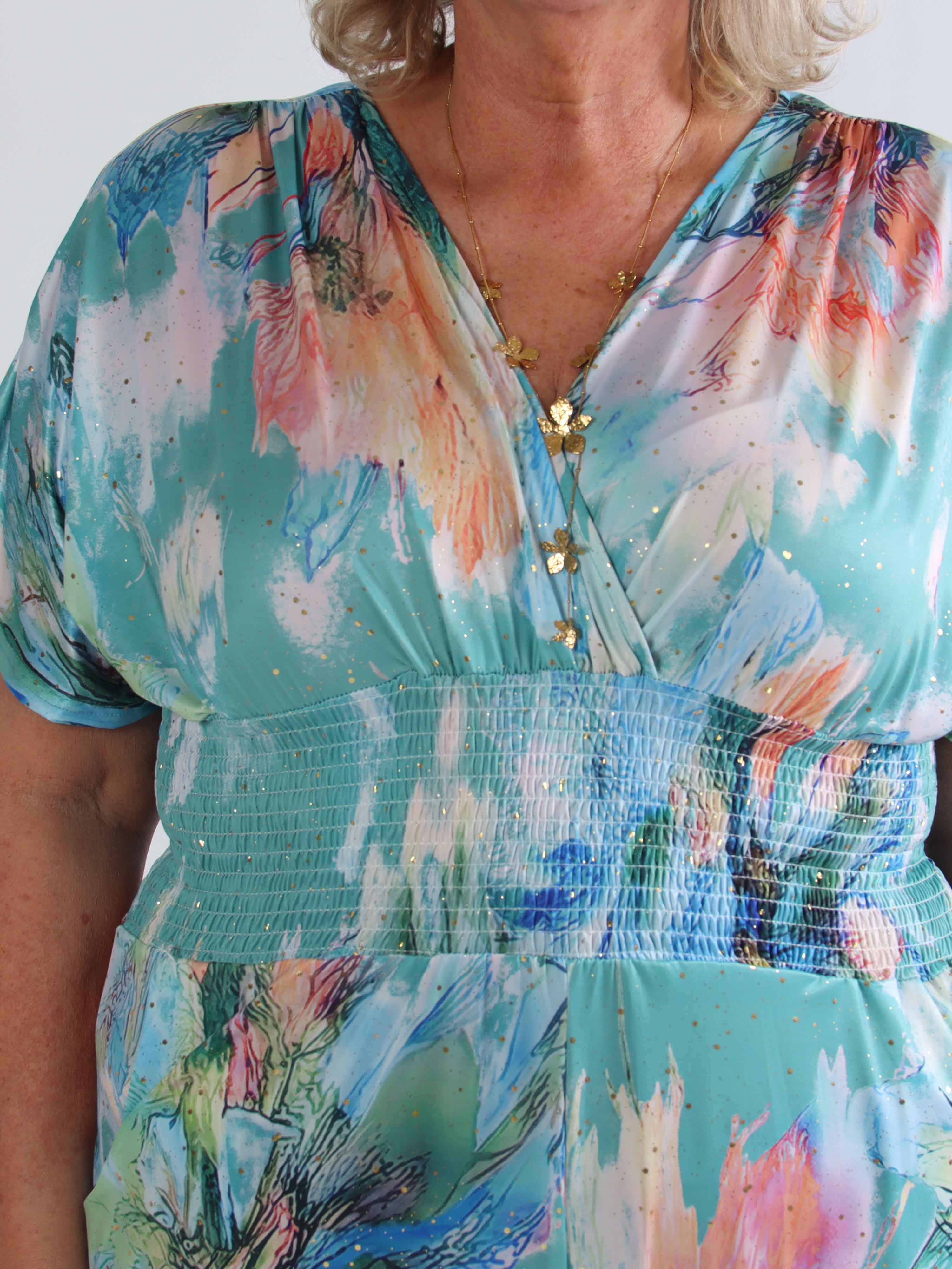 Pams Print Jumpsuit - Stretchig mönstrad plus size jumpsuit med guldfärgat damm