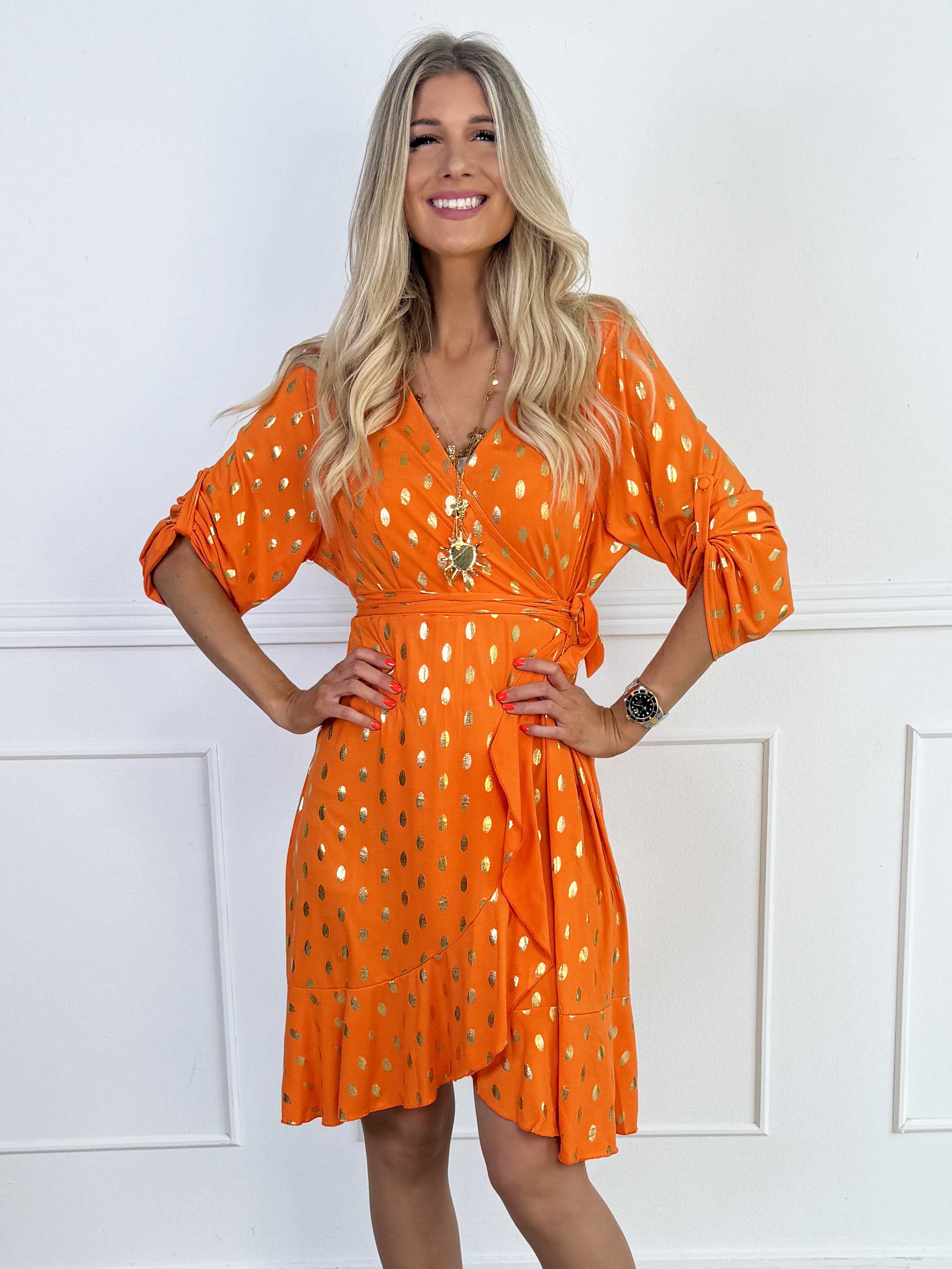 Savina Gold - Elastisk klänning i omlott-look med guldprickar