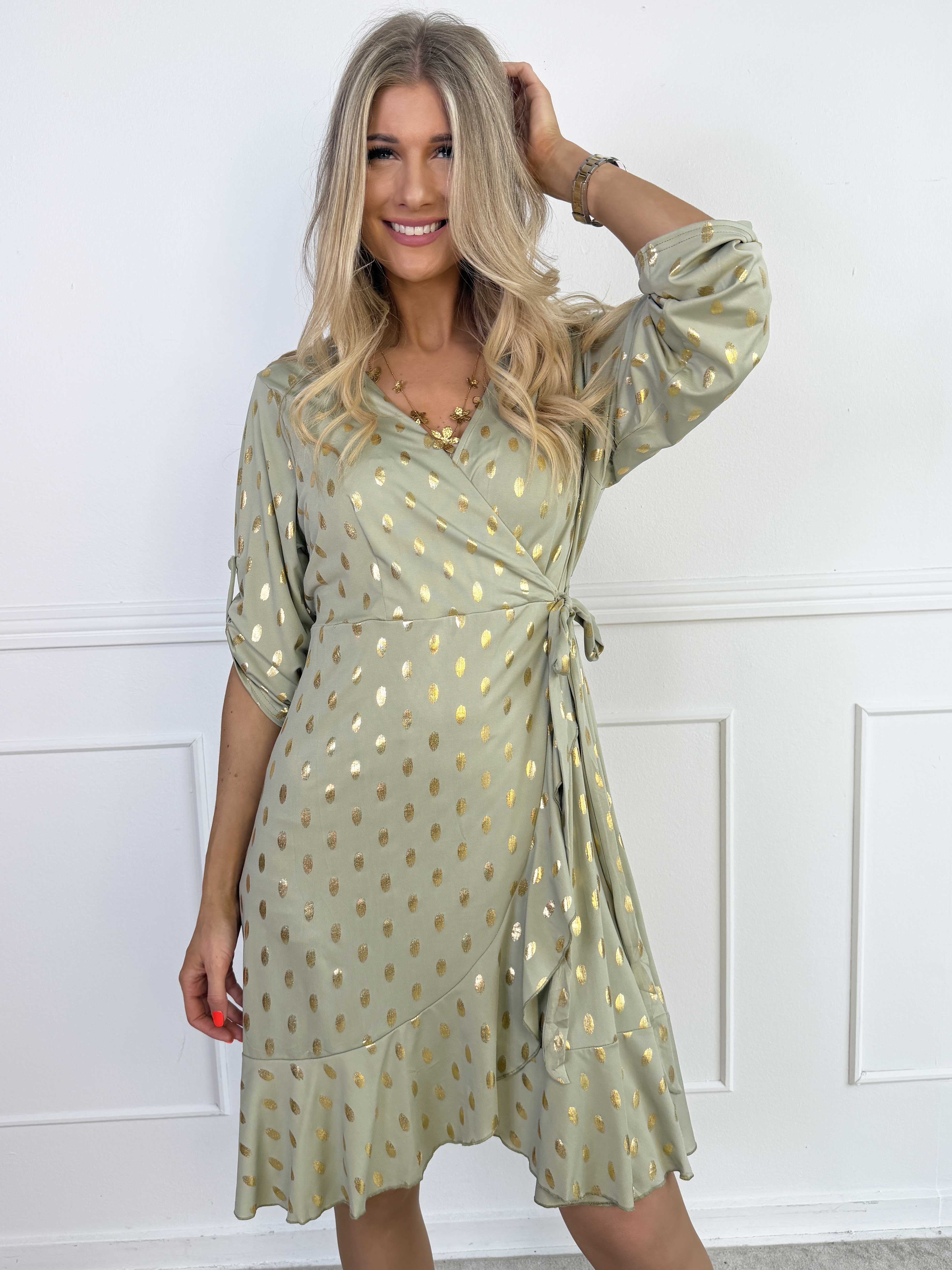 Savina Gold - Elastisk klänning i omlott-look med guldprickar