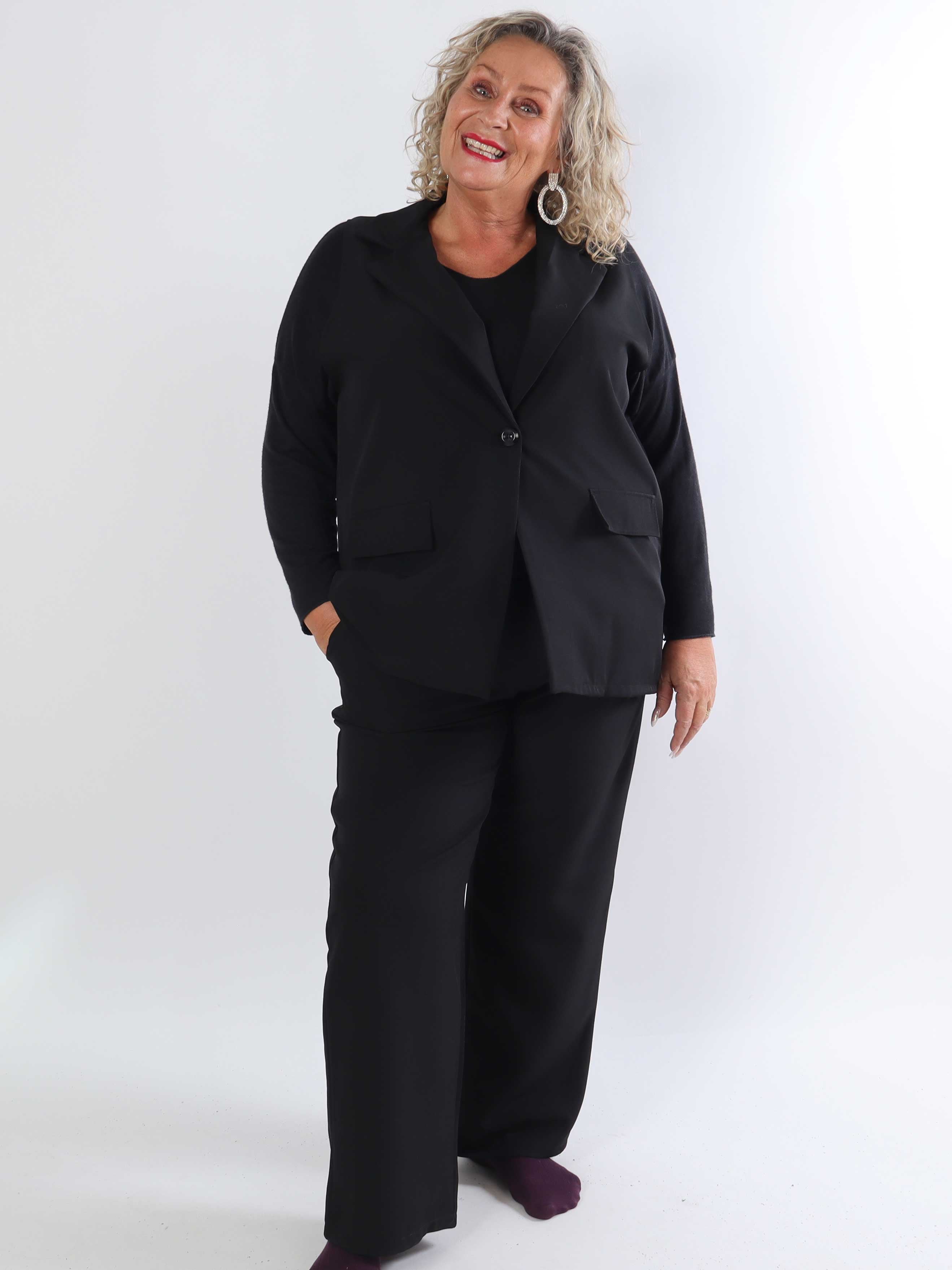 Shadia Pants - Enfärgade kostymbyxor med resår i ryggen