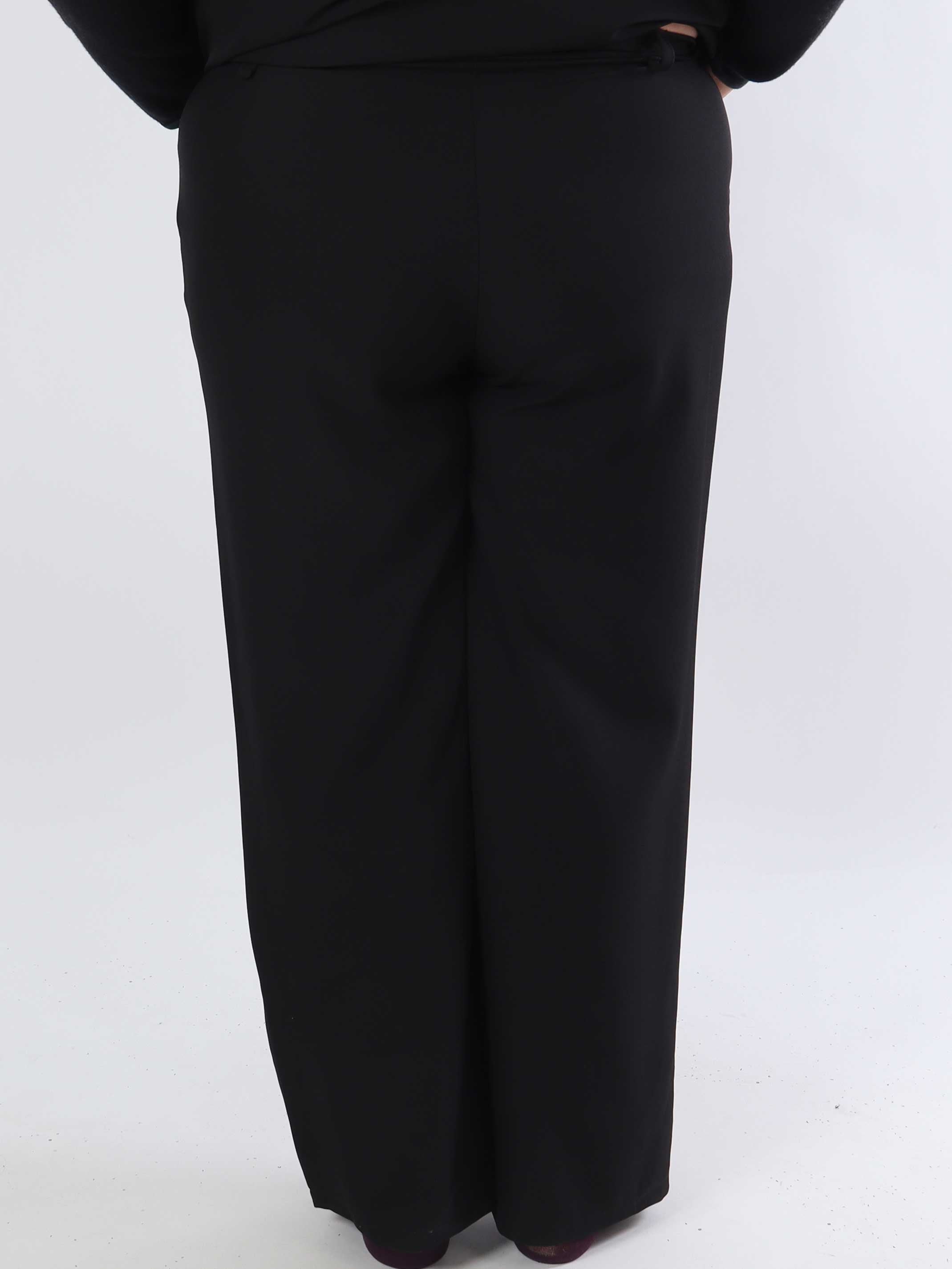 Shadia Pants - Enfärgade kostymbyxor med resår i ryggen