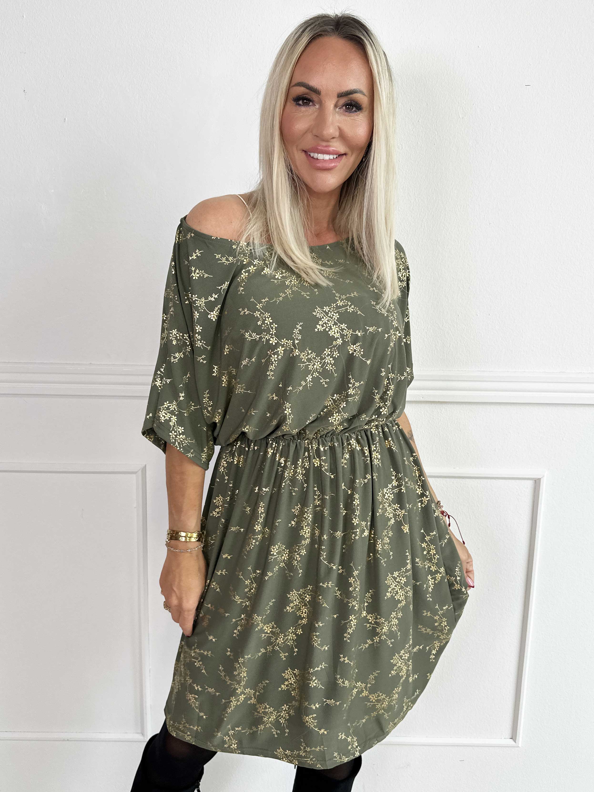 Venus Gold - Elastisk klänning mönstrad med guldfärgade blommor