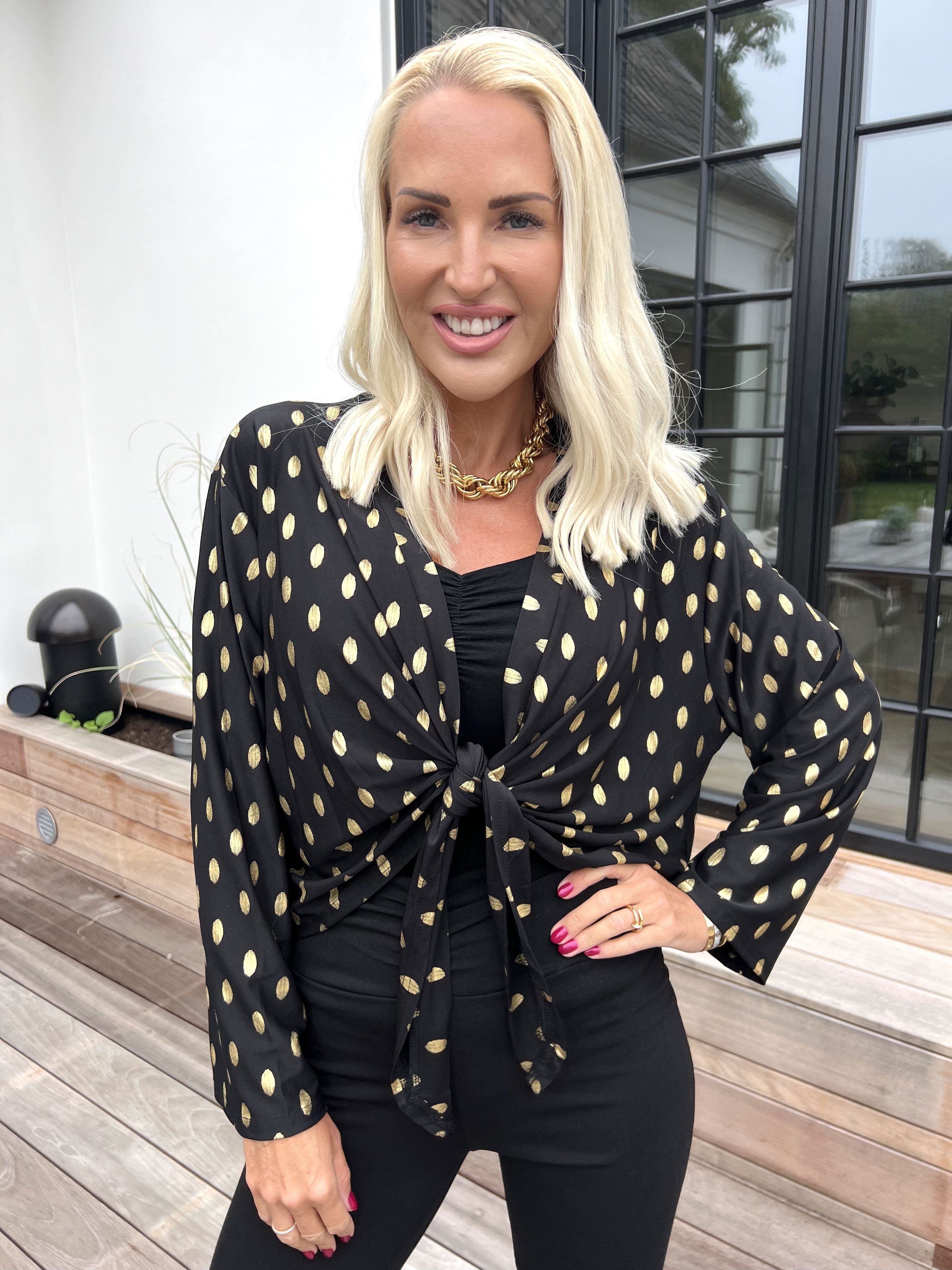 Werena Dot - Kort elastisk kofta med guldfärgade prickar