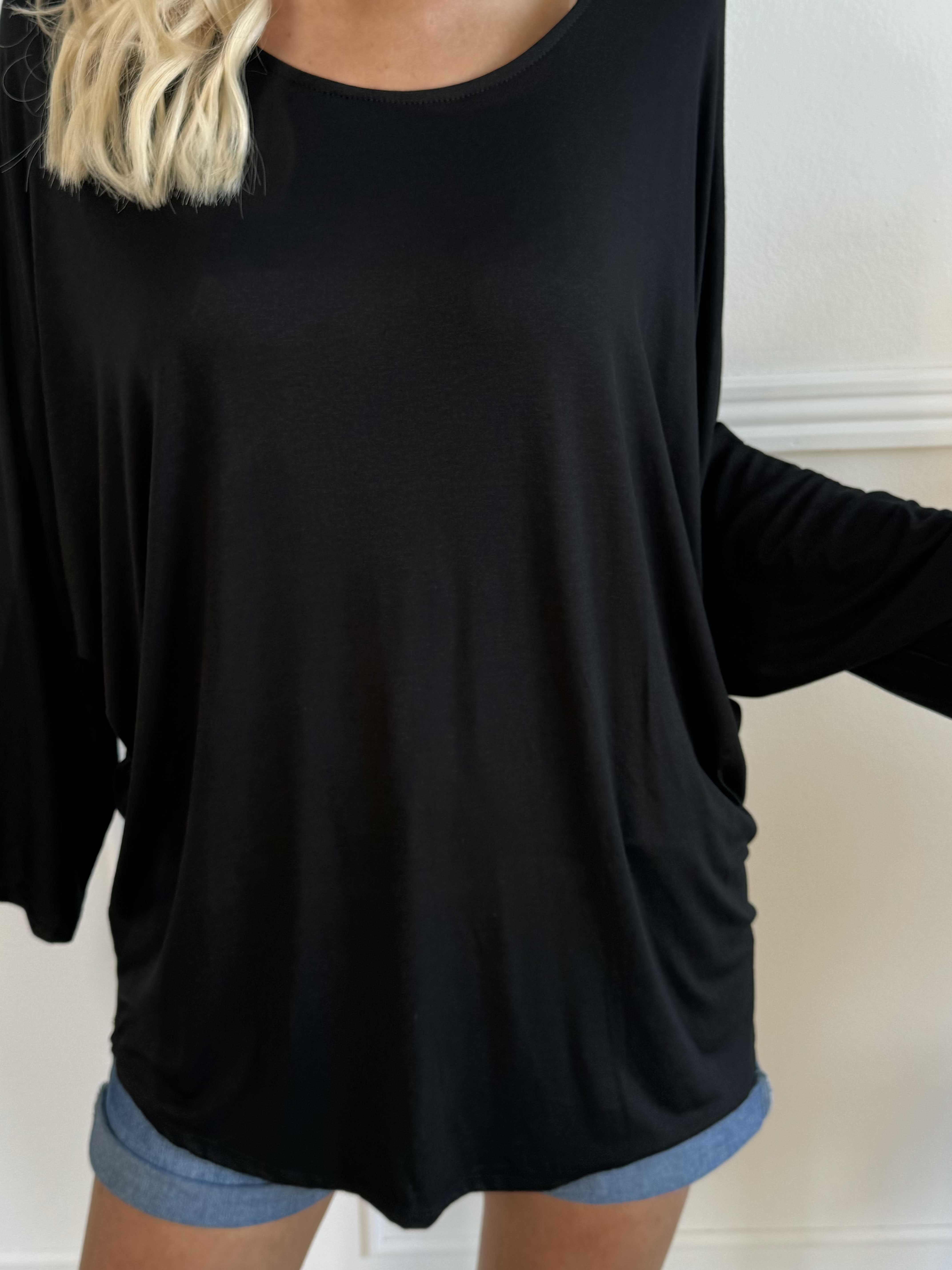 Augustine - Blus i stretchigt tyg med fladdermusärmar