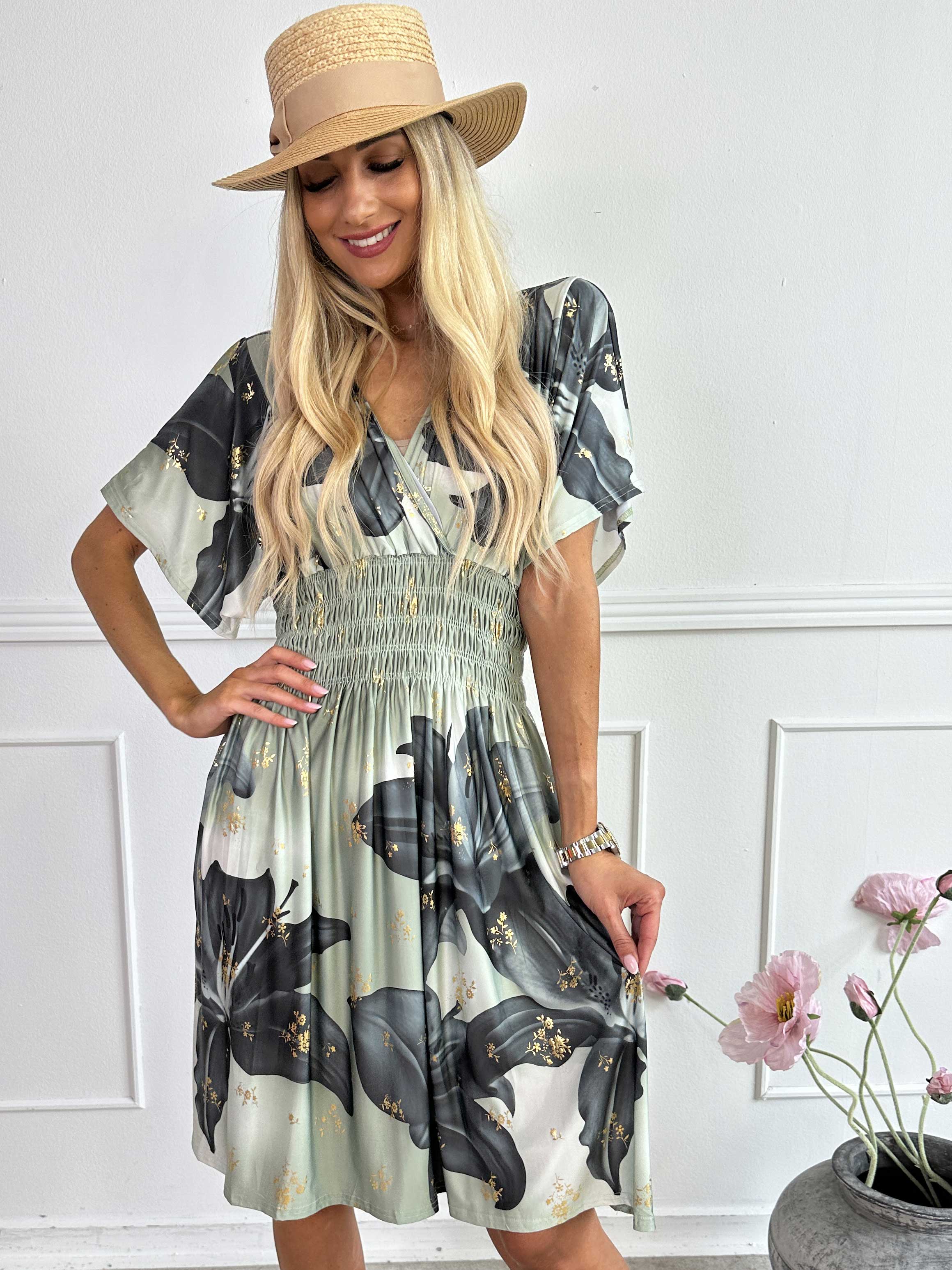 Pams Big Lily Short - Kort elastisk klänning med stora liljor och gulddetaljer