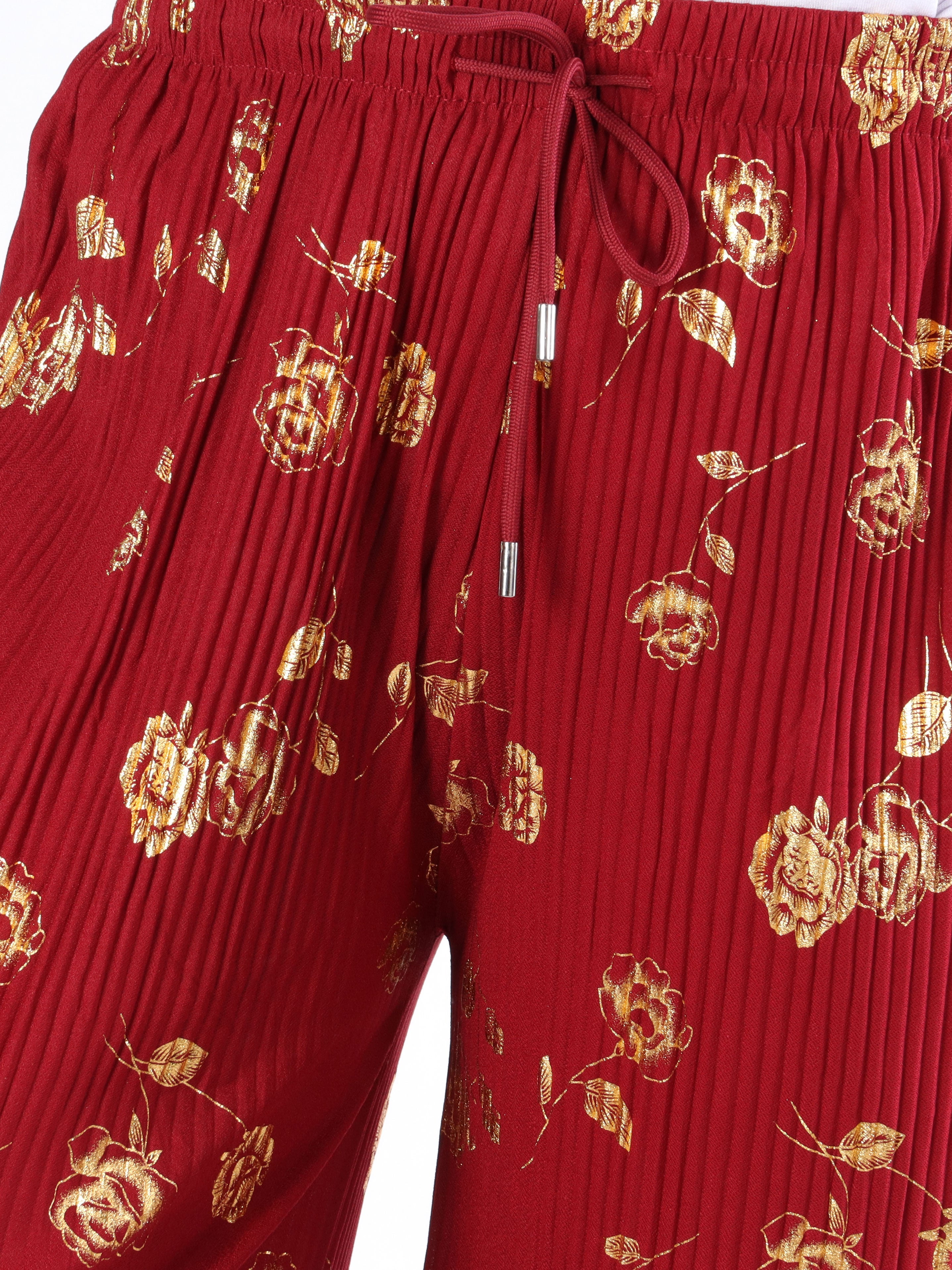 Alpha - Plisserade byxor med guldblommor