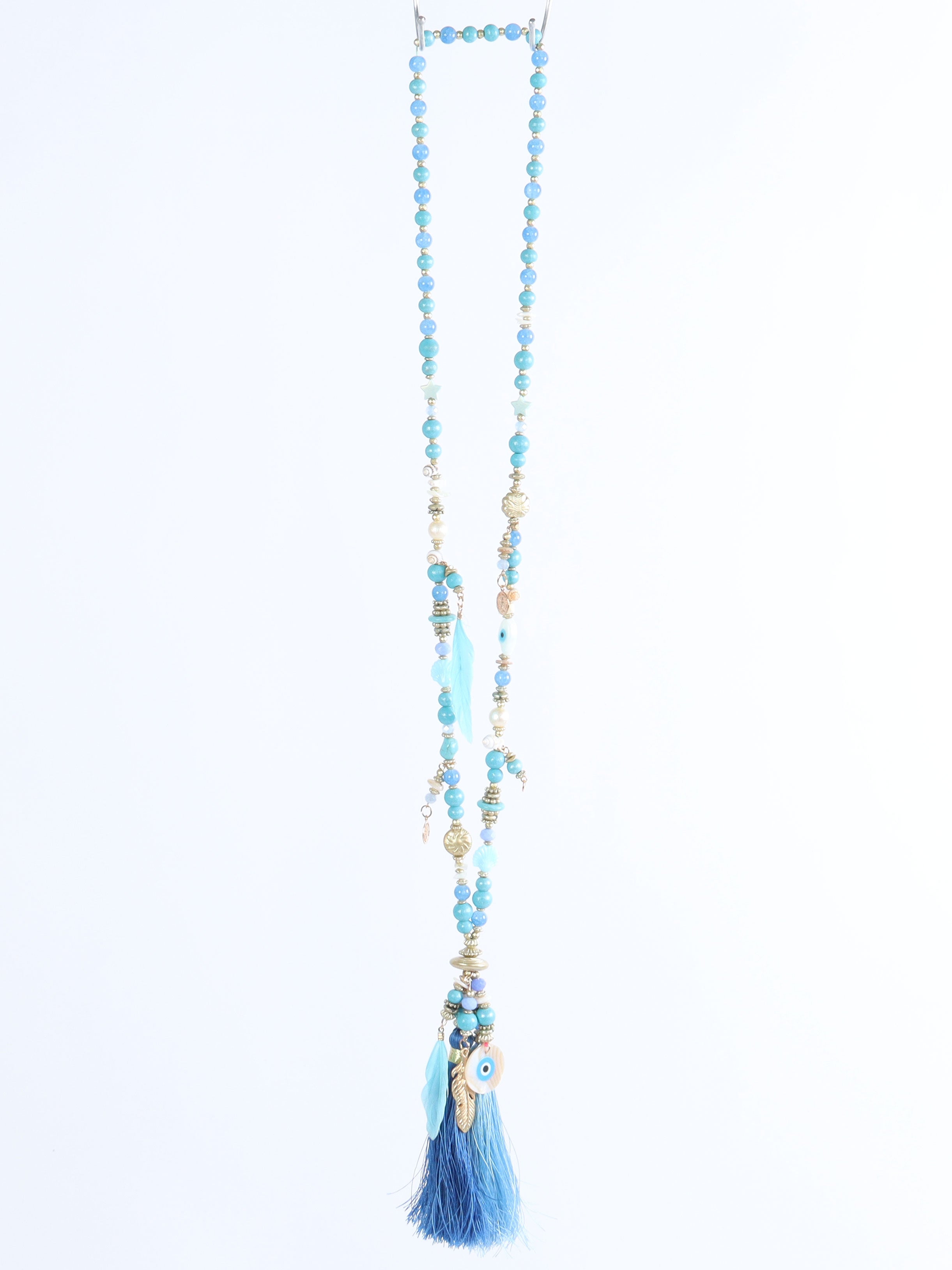 Melda - Beige halsband med fina pärlor och två tofsar