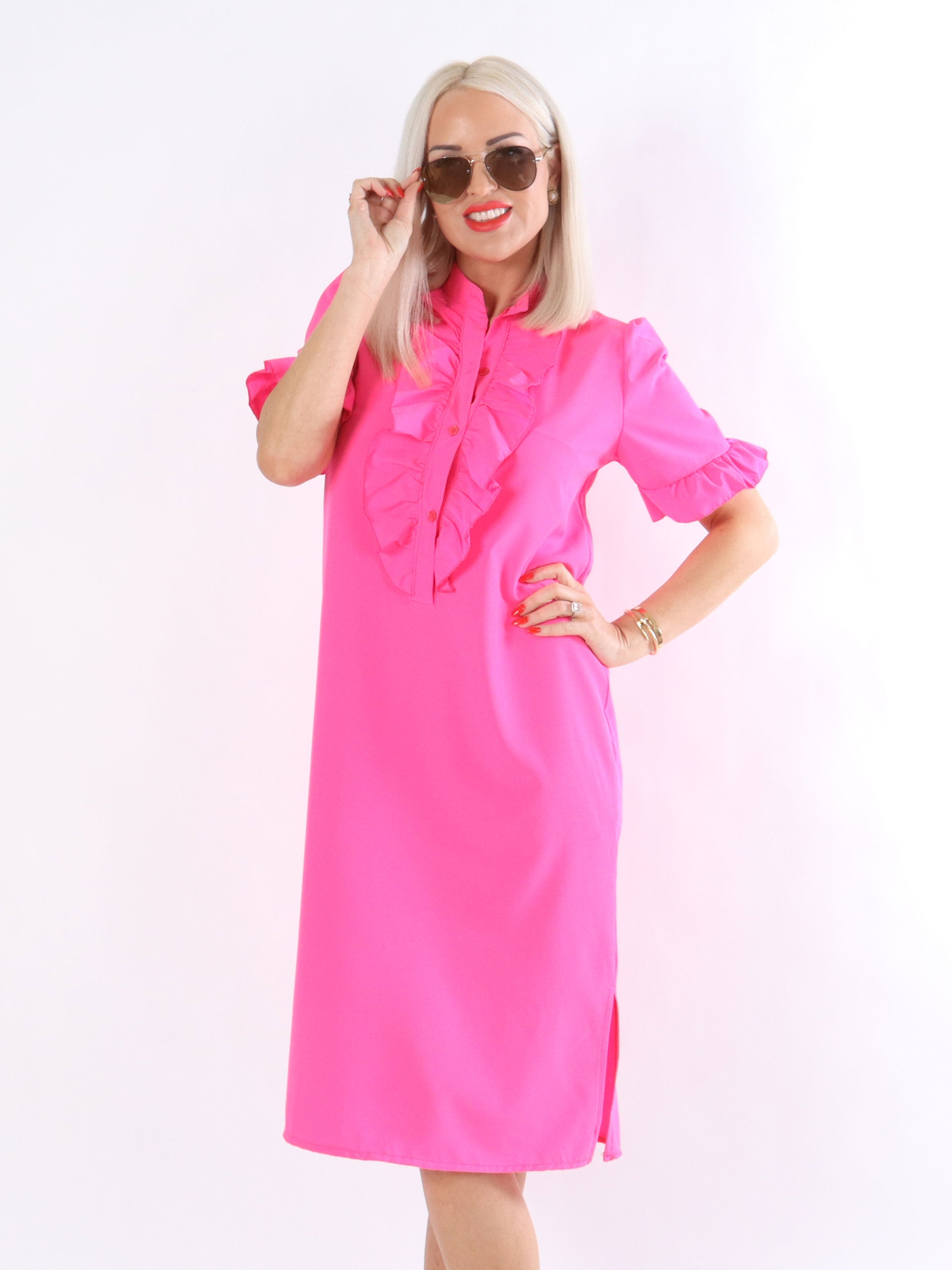 Sigga - Klänning med volanger och puffärmar