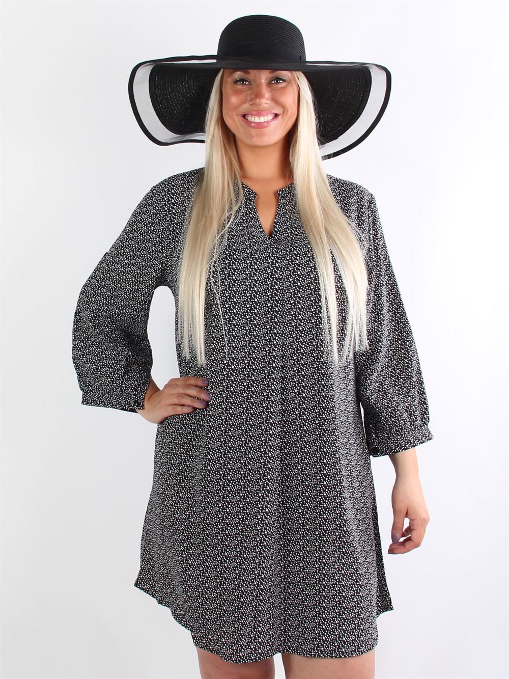 Makenna - Svart tunikaklänning med vita prickar och v-ringning