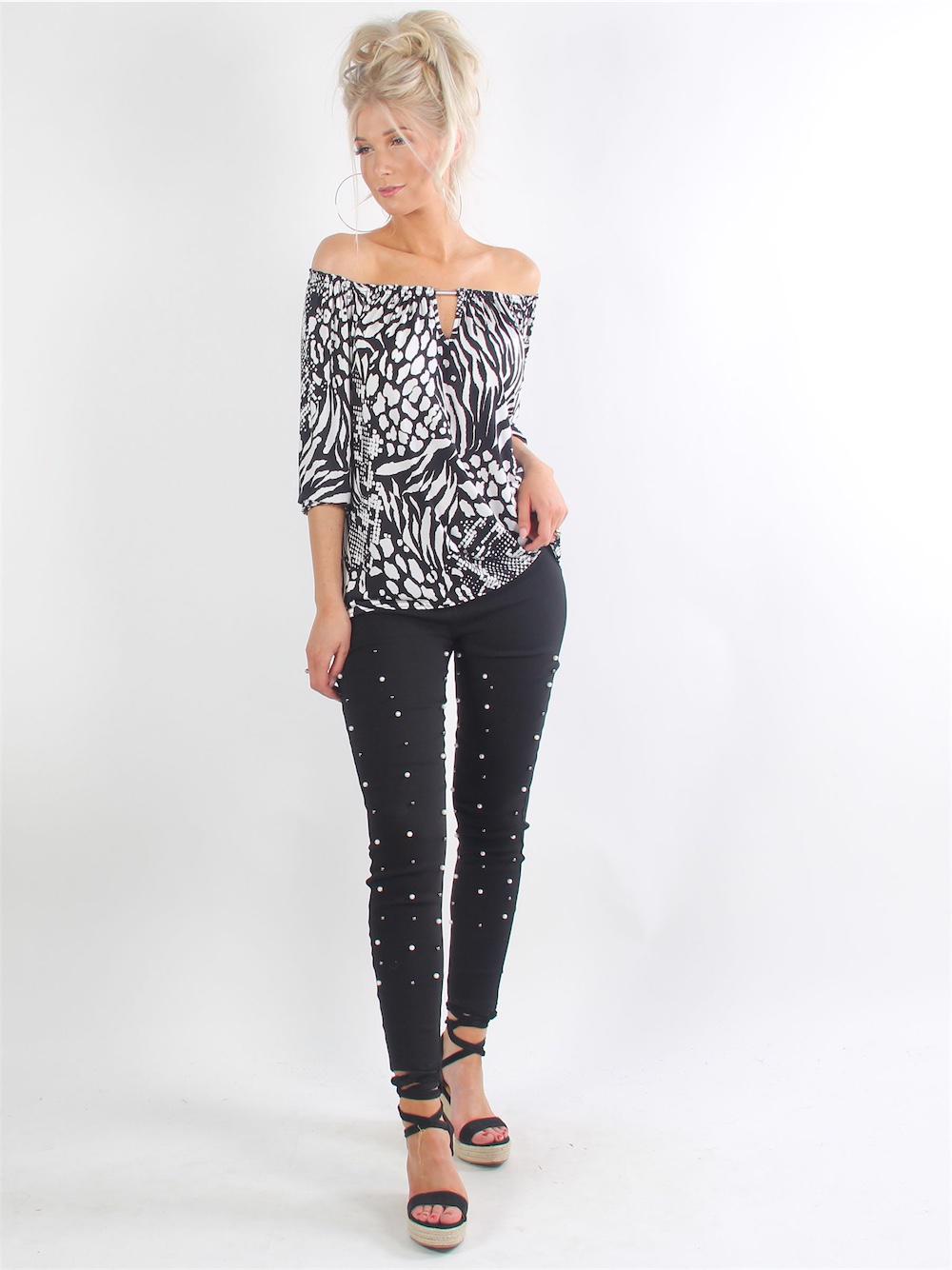 Trille - Svarta leggings i stretchmaterial med pärlor längs benen